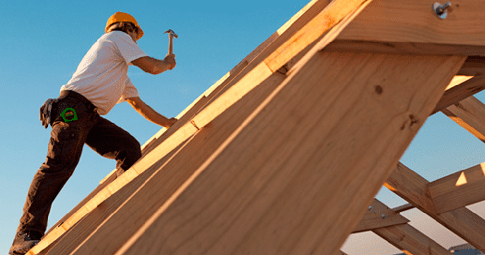 roofer nailing in a wooden beam