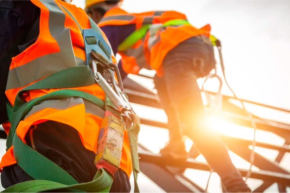 workers climbing a roof