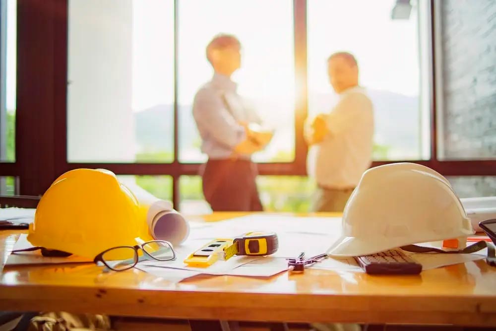 architect and engineer talking in office
