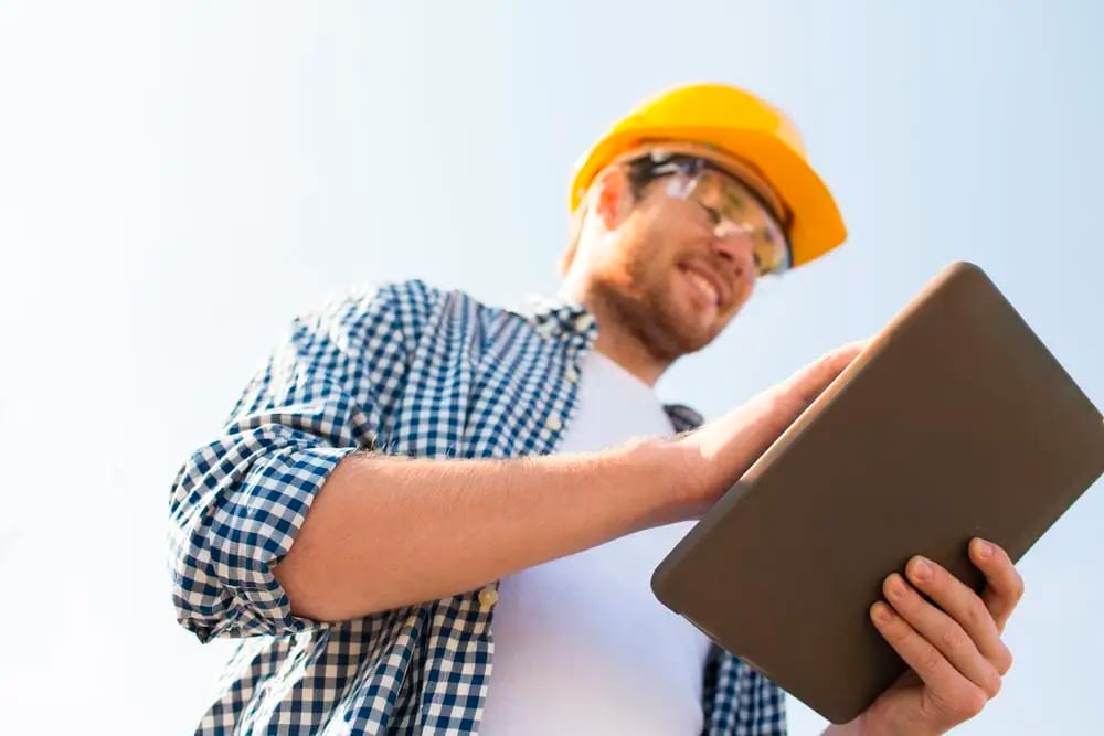 worker checking a tablet