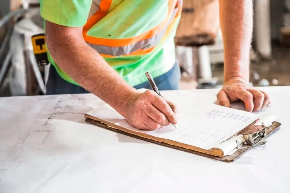 worker taking notes