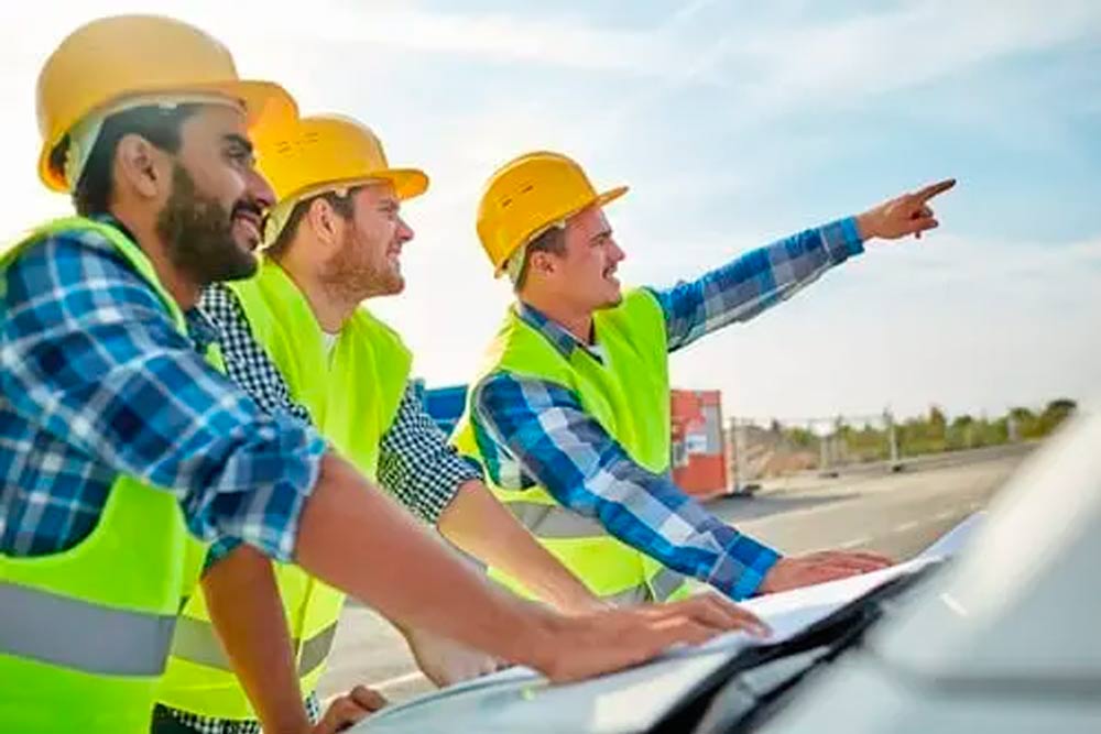 workers pointing to something on the construction site