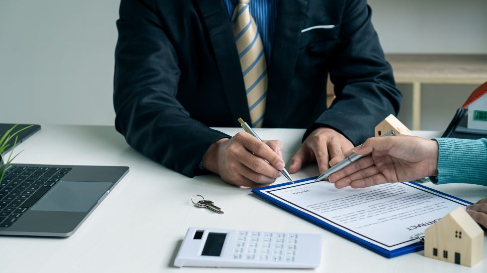 Executives signing with confidence because they know the difference between a bonded and an insured and which one suits them best.